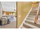 Inviting living room with staircase and an open floor plan at 27054 Fordham Dr, Wesley Chapel, FL 33543