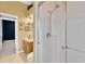 Walk-in shower with tile surround and glass door at 27054 Fordham Dr, Wesley Chapel, FL 33543