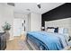 Inviting bedroom with a plush bed, modern decor, and an ensuite bathroom at 31966 Asbury Ave, Wesley Chapel, FL 33545