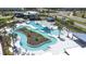 Aerial view of the stunning community lazy river, a perfect spot for relaxation and Gathering fun at 31966 Asbury Ave, Wesley Chapel, FL 33545