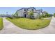 Well-maintained home featuring a green lawn and a neatly paved driveway leading to a garage at 31966 Asbury Ave, Wesley Chapel, FL 33545