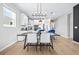 Beautifully designed open concept dining and kitchen area with modern appliances and ample natural light at 31966 Asbury Ave, Wesley Chapel, FL 33545