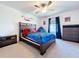 Bedroom featuring a bed, dresser, and ceiling fan at 32046 Powderpuff Mimosa Dr, San Antonio, FL 33576