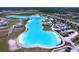 Aerial view of a large community pool with amenities and parking at 32046 Powderpuff Mimosa Dr, San Antonio, FL 33576