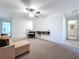 View of the upstairs living room showing neutral carpeting and a modern decor for a relaxing atmosphere at 32046 Powderpuff Mimosa Dr, San Antonio, FL 33576