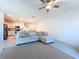 Open-concept living room with a kitchen view provides a spacious and connected living experience at 32046 Powderpuff Mimosa Dr, San Antonio, FL 33576