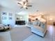 Open-concept living room with kitchen and dining area, perfect for entertaining and Gathering gatherings at 32046 Powderpuff Mimosa Dr, San Antonio, FL 33576