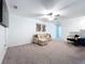 Bright, open living room with stylish decor and neutral carpeting, a comfortable space for relaxation at 32046 Powderpuff Mimosa Dr, San Antonio, FL 33576