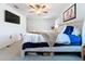An airy Primary bedroom with plush carpeting, ample daylight, and sleek furniture for a relaxing retreat at 32046 Powderpuff Mimosa Dr, San Antonio, FL 33576