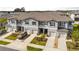 A high angle view of townhomes in a planned community with private drives and landscaping at 36519 Garden Wall Way, Zephyrhills, FL 33541