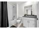 A clean bathroom with a shower and bathtub, complemented by a stylish vanity at 36519 Garden Wall Way, Zephyrhills, FL 33541