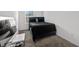 Bedroom with carpet flooring, window, and side table decor at 36519 Garden Wall Way, Zephyrhills, FL 33541