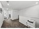 Open bonus room featuring neutral walls and carpeted flooring with convenient access to a bedroom at 36519 Garden Wall Way, Zephyrhills, FL 33541