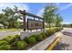 Attractive community sign for Abbott Square surrounded by manicured landscaping at 36519 Garden Wall Way, Zephyrhills, FL 33541
