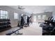 Well-equipped gym featuring treadmills, weight machines, and free weights at 36519 Garden Wall Way, Zephyrhills, FL 33541