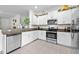 Modern kitchen featuring granite counters and stainless steel appliances at 36519 Garden Wall Way, Zephyrhills, FL 33541