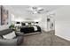 The main bedroom includes a ceiling fan, decor, and an ensuite bathroom at 36519 Garden Wall Way, Zephyrhills, FL 33541