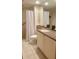 Bright bathroom featuring a spacious walk-in shower with a clear glass door and light-colored tile at 36750 Us 19 N # 3-124, Palm Harbor, FL 34684