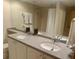 Well-lit bathroom with double sinks, ample counter space, and a full-sized mirror at 36750 Us 19 N # 3-124, Palm Harbor, FL 34684