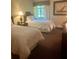 Cozy bedroom featuring two twin beds, a window view, and simple, elegant decor at 36750 Us 19 N # 3-124, Palm Harbor, FL 34684