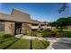 Well-maintained condominium building with brick facade and manicured landscaping at 36750 Us 19 N # 3-124, Palm Harbor, FL 34684