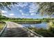 Scenic golf course view showcasing a serene water feature and meticulously maintained green at 36750 Us 19 N # 3-124, Palm Harbor, FL 34684