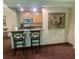 Cozy eat-in kitchen with wood cabinets, breakfast bar, and stainless steel microwave at 36750 Us 19 N # 3-124, Palm Harbor, FL 34684