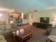 Comfortable living room featuring a modern kitchen, plush seating, and a large flat-screen television at 36750 Us 19 N # 3-124, Palm Harbor, FL 34684