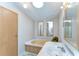 Bright bathroom with a soaking tub, white vanity, and ample counter space at 4041 Lane Rd, Zephyrhills, FL 33541