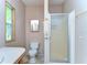 Clean bathroom featuring a toilet, shower, and a stylish vanity with ample counter space at 4041 Lane Rd, Zephyrhills, FL 33541