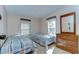 Bedroom featuring two beds, dresser, and windows offering natural light at 4041 Lane Rd, Zephyrhills, FL 33541