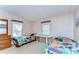 Bedroom featuring two beds, dresser, and windows offering natural light at 4041 Lane Rd, Zephyrhills, FL 33541