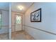 Inviting entryway with a front door and a large decorative picture hanging on the wall at 4041 Lane Rd, Zephyrhills, FL 33541