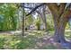 Charming home surrounded by mature trees, offering a private and peaceful setting with ample shade at 4041 Lane Rd, Zephyrhills, FL 33541