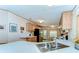 Bright kitchen features a stainless steel sink, ample counter space, and modern appliances at 4041 Lane Rd, Zephyrhills, FL 33541
