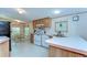 Well-equipped kitchen with white appliances and an adjacent dining area for a convenient cooking experience at 4041 Lane Rd, Zephyrhills, FL 33541