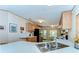 Well-equipped kitchen with a stainless steel sink, ample counter space, and modern appliances at 4041 Lane Rd, Zephyrhills, FL 33541