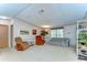 Spacious living room with neutral walls, comfortable seating, and natural light from the window at 4041 Lane Rd, Zephyrhills, FL 33541