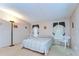 Well-lit main bedroom featuring a queen bed, two windows, and comfortable furnishings at 4041 Lane Rd, Zephyrhills, FL 33541