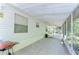 Spacious screened-in porch, perfect for relaxing and enjoying the outdoors, with a grill at 4041 Lane Rd, Zephyrhills, FL 33541