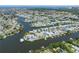 Extensive aerial view of a waterfront community boasting a complex network of canals and varied architectural designs at 424 Bahama Grande Blvd, Apollo Beach, FL 33572