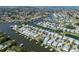 Gorgeous aerial view of a waterfront community with canals, lush greenery, and beautiful single-Gathering homes at 424 Bahama Grande Blvd, Apollo Beach, FL 33572