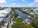 Waterfront homes with private boat docks line the canal under a sunny sky at 424 Bahama Grande Blvd, Apollo Beach, FL 33572