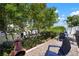Inviting backyard featuring waterway views, mature trees and vegetation, a fire pit, and comfortable seating, perfect for relaxing at 424 Bahama Grande Blvd, Apollo Beach, FL 33572