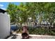 Outdoor patio area features a decorative chiminea, landscaping, and waterfront views at 424 Bahama Grande Blvd, Apollo Beach, FL 33572
