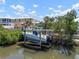 Backyard boat lift on canal with room for boat storage and easy access to the water at 424 Bahama Grande Blvd, Apollo Beach, FL 33572