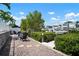 Beautifully landscaped backyard with waterfront access, fire pit, and seating area at 424 Bahama Grande Blvd, Apollo Beach, FL 33572