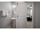 Elegant bathroom with a pedestal sink and doorway view into a bedroom at 424 Bahama Grande Blvd, Apollo Beach, FL 33572