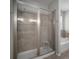 Modern bathroom featuring a glass-enclosed shower with neutral-toned tiling and a small corner bench at 424 Bahama Grande Blvd, Apollo Beach, FL 33572