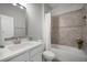 Relaxing bathroom featuring a shower-tub, quartz countertop, and fresh flowers at 424 Bahama Grande Blvd, Apollo Beach, FL 33572